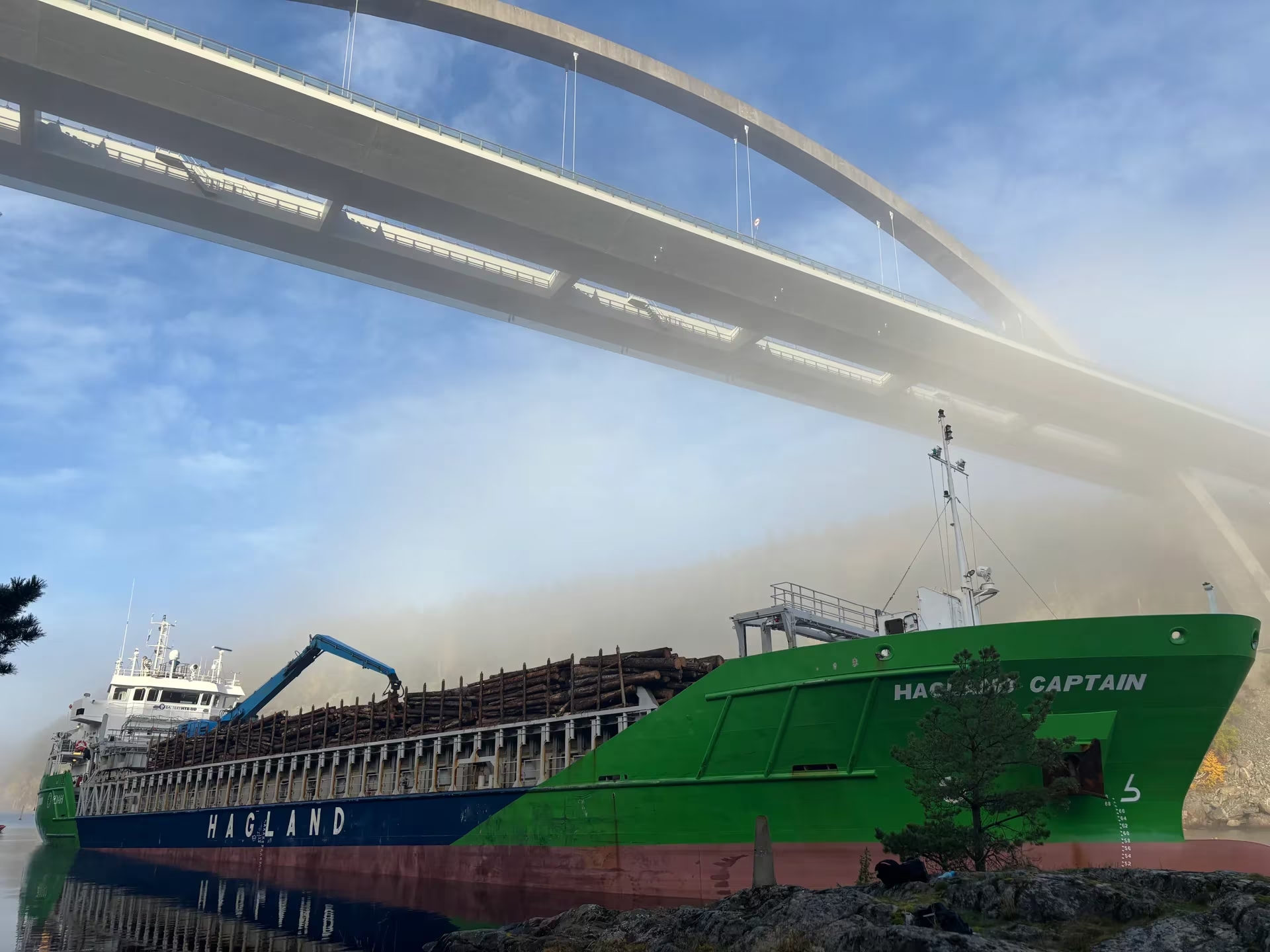 A Norwegian cargo ship grounds under the Svinesund Bridge, which connects Norway and Sweden.